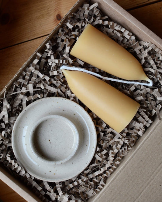 Stubby beeswax candles and ceramic candle holder in a gift box