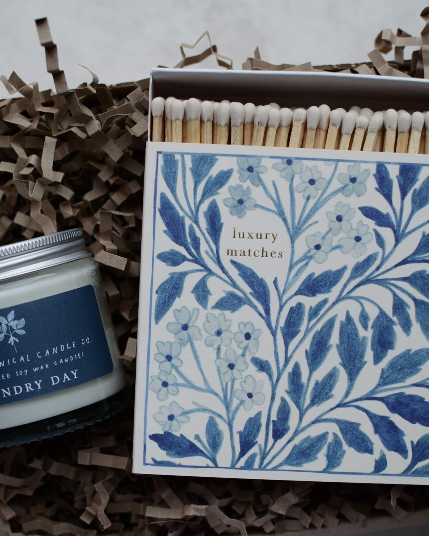 A detail shot of a blue and white themed candle gift box.