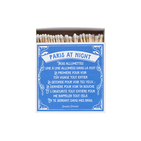 Blue and white matchbox with a French poem, "Paris at Night".