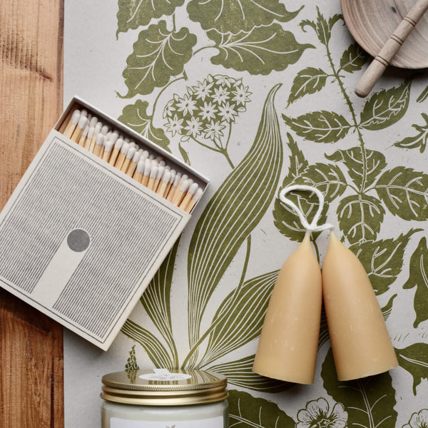 Rain letterpress matches by Archivist Real Fun Wow, with botanical print and beeswax stubby candles.