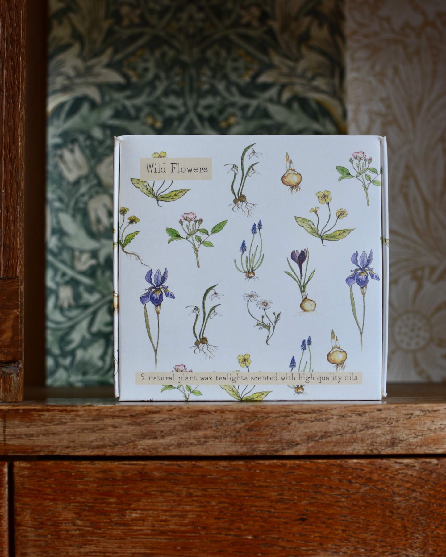 An box of tealights, with a botanical illustration on the front.