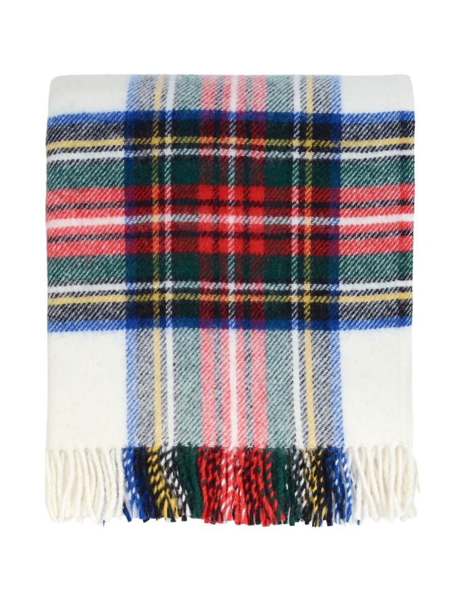 Plaid wool blanket with colourful pattern on a white background