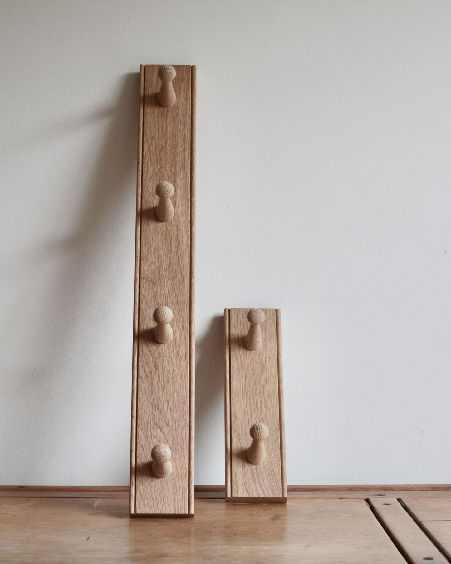 Pair of oak shaker peg rails by Creamore Mill