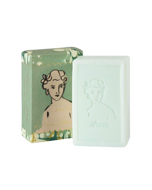 Bar of soap with a decorative packaging featuring an illustration on a white background
