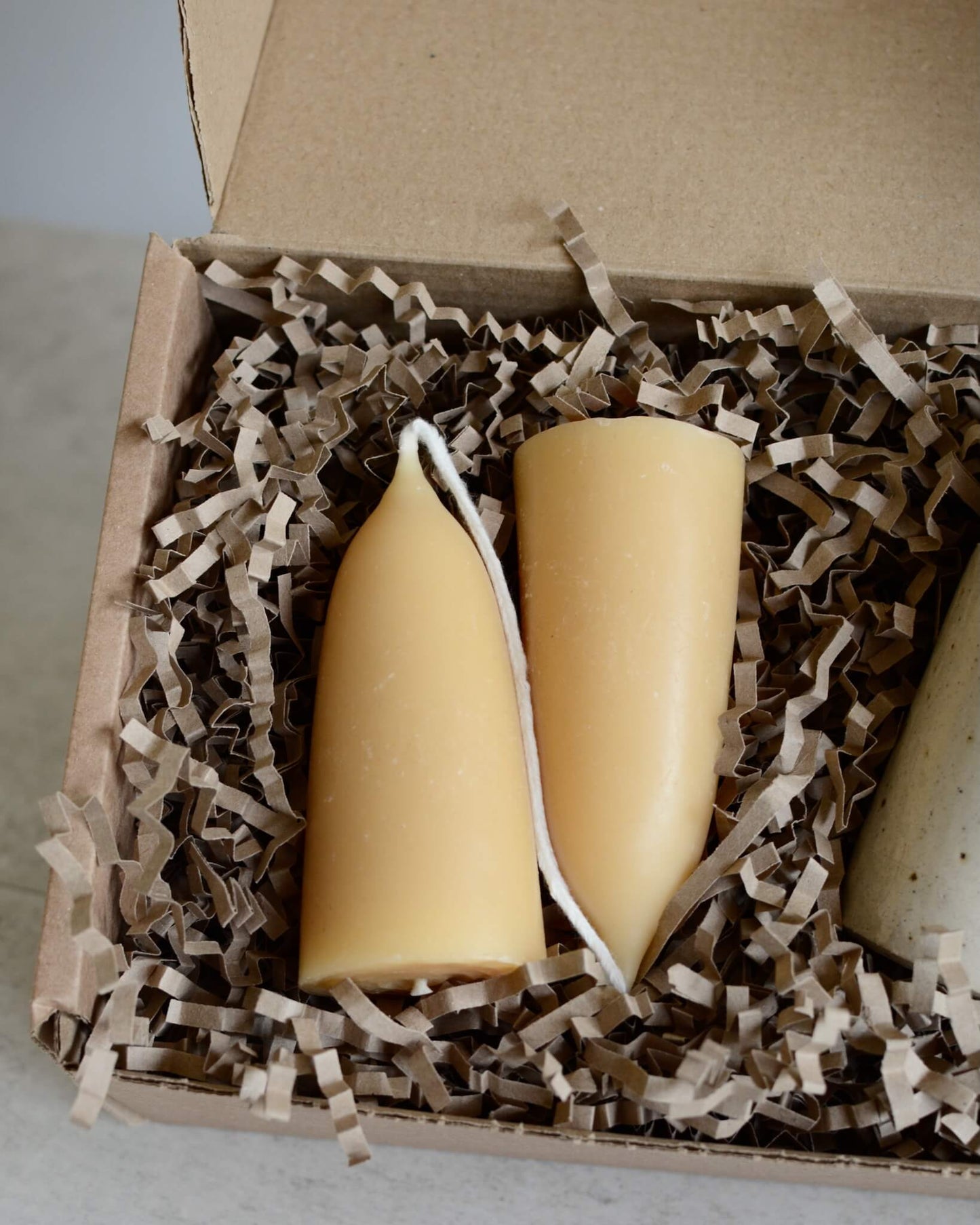Close up of beeswax candles, inside a gift box,