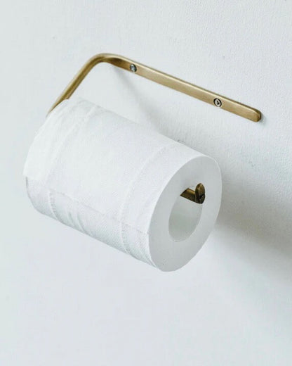 A solid brass toilet roll holder.