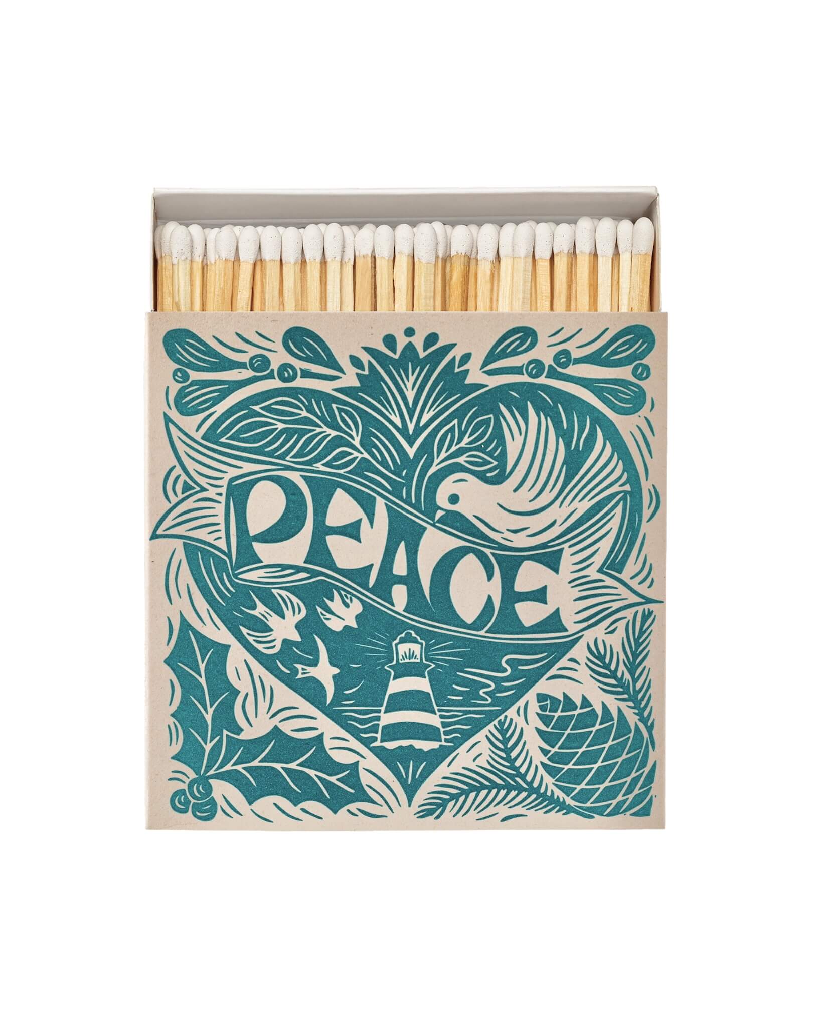 A box of letterpress matches with a Christmas peace theme, featuring a Cornish lighthouse, sea, birds, and festive design on a teal blue background.