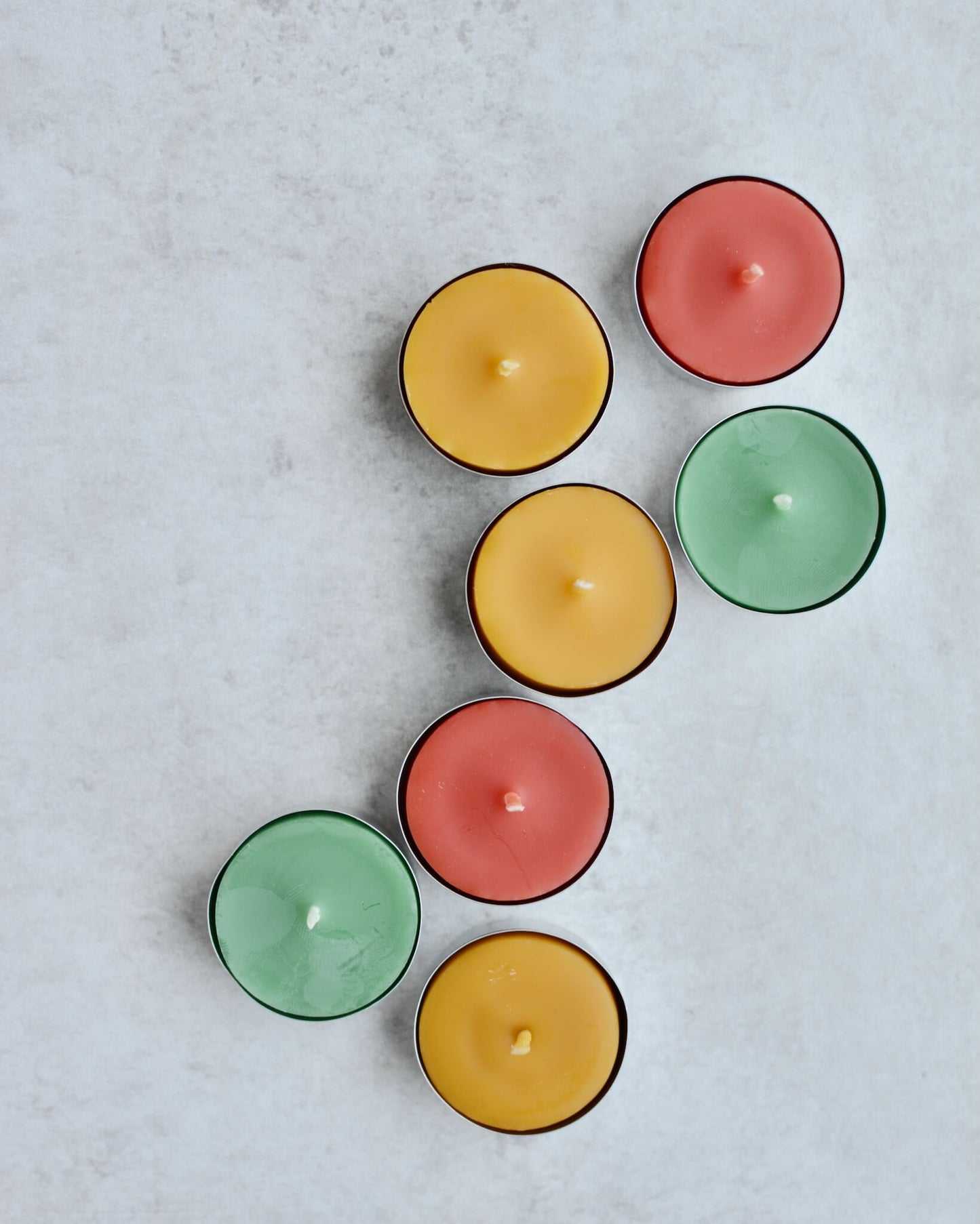Colourful beeswax tealights in Spring colours.