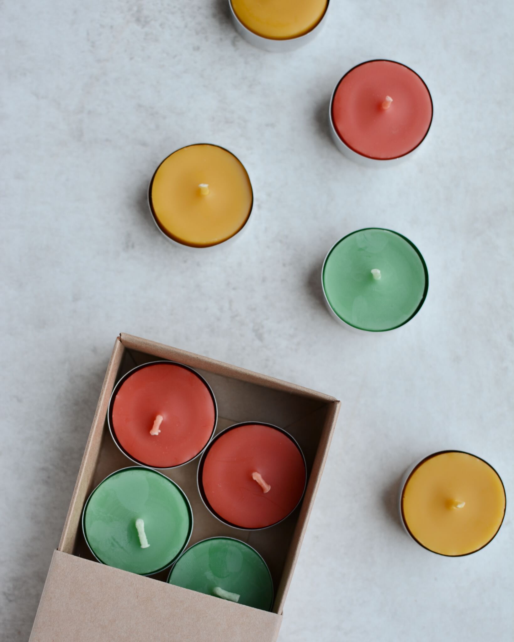 Colourful beeswax tealights in Spring colours.