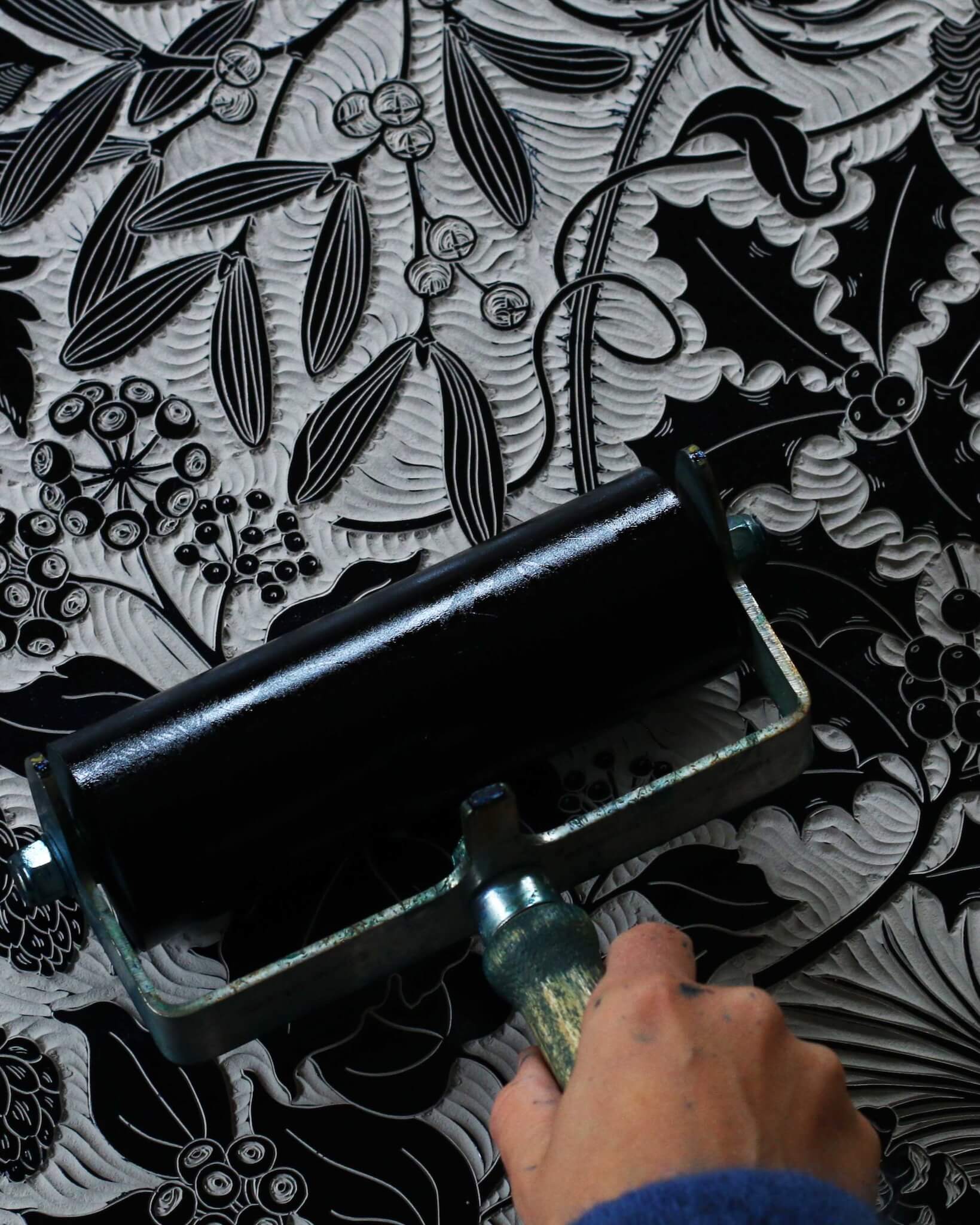 Linocut print block being inked up.