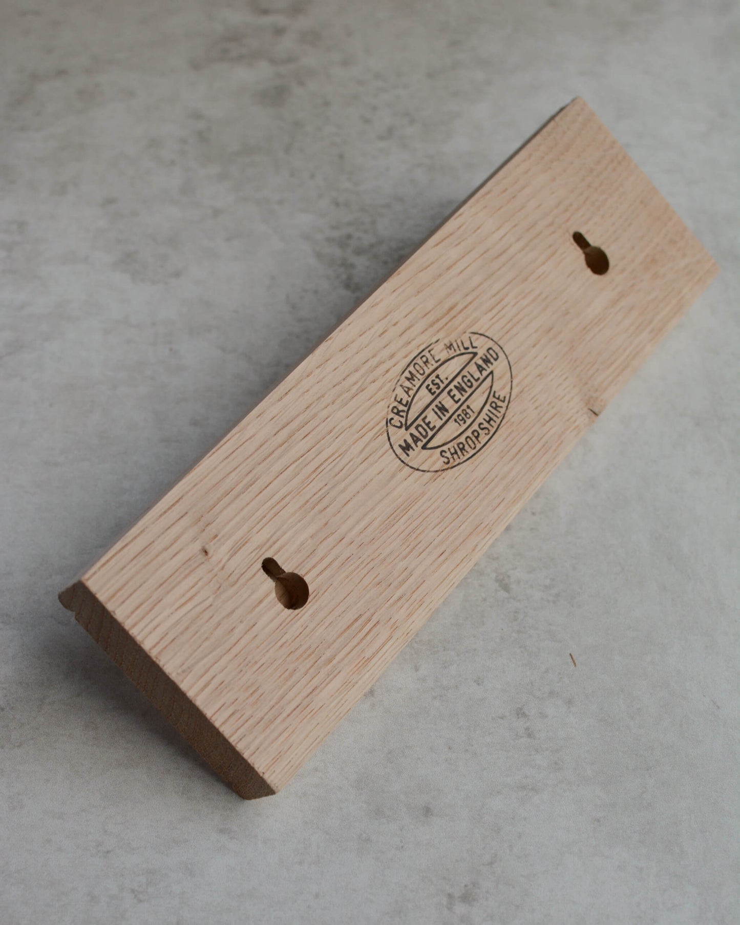 The back of an oak key rack by Creamore Mill, showing keyhole fixing