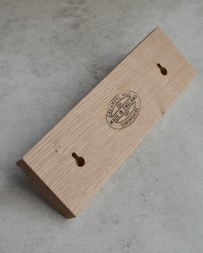 The back of an oak key rack by Creamore Mill, showing keyhole fixing