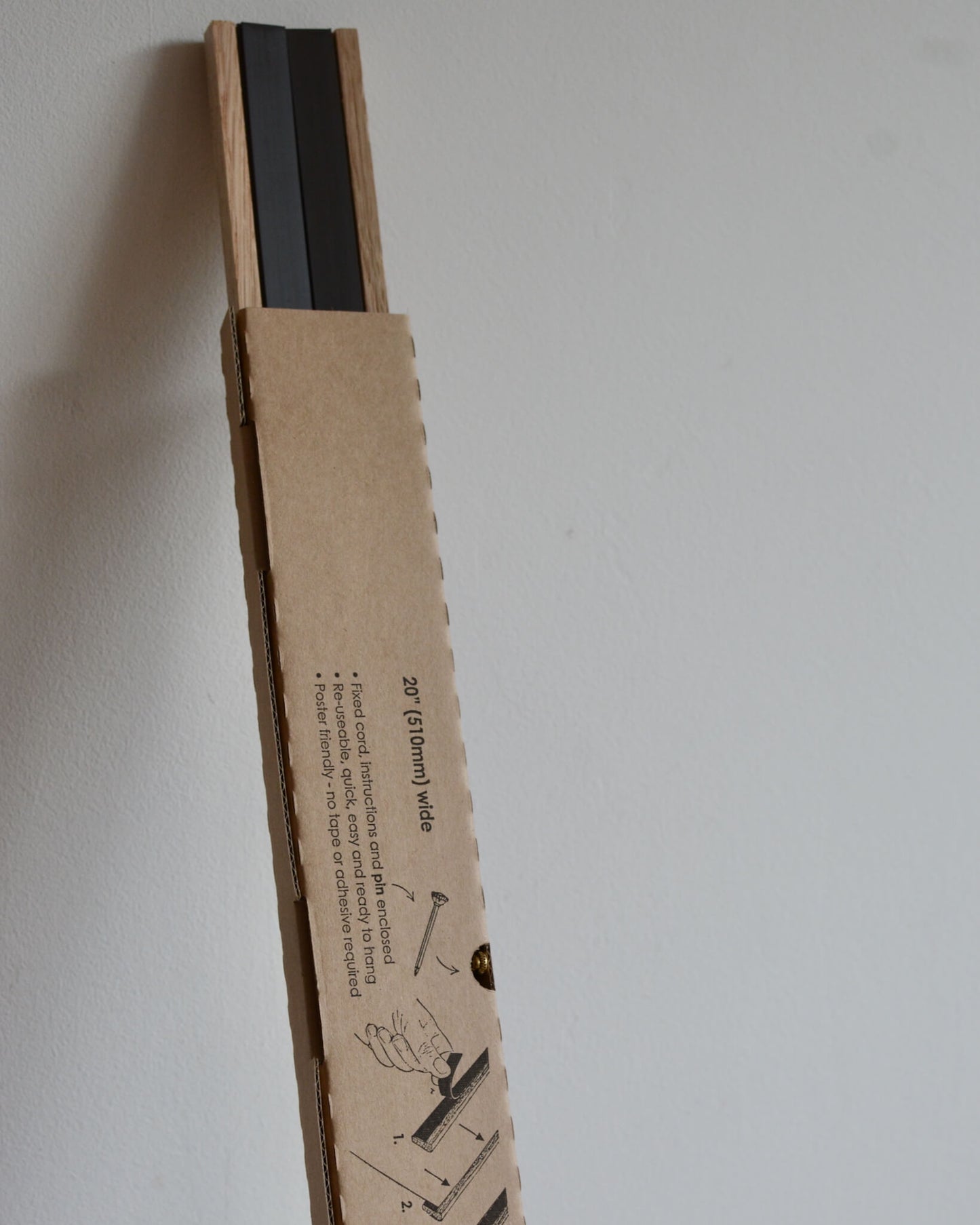 An oak magnetic poster hanger.