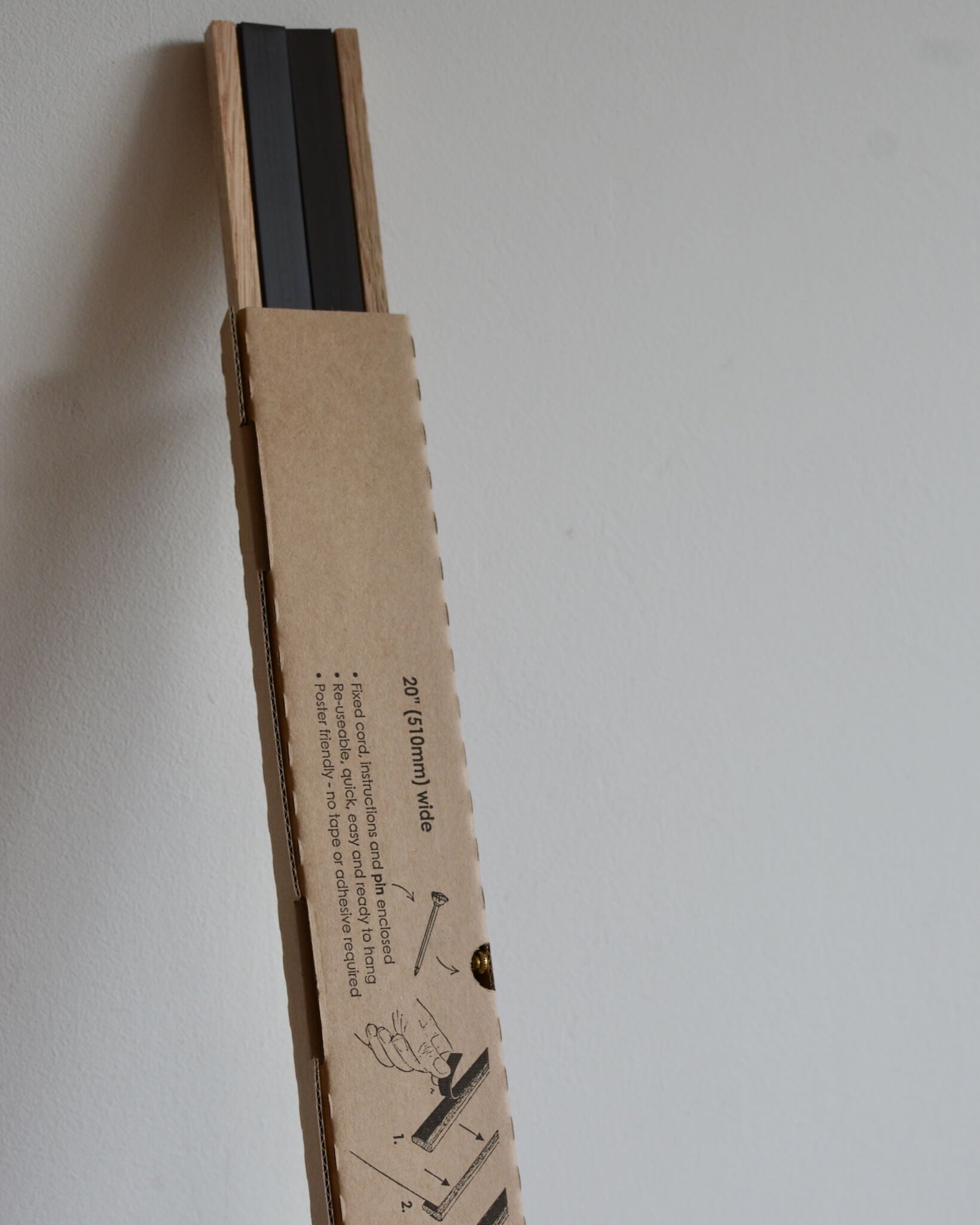 An oak magnetic poster hanger.