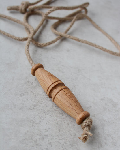 Oak toggle-style light pull with jute rope.