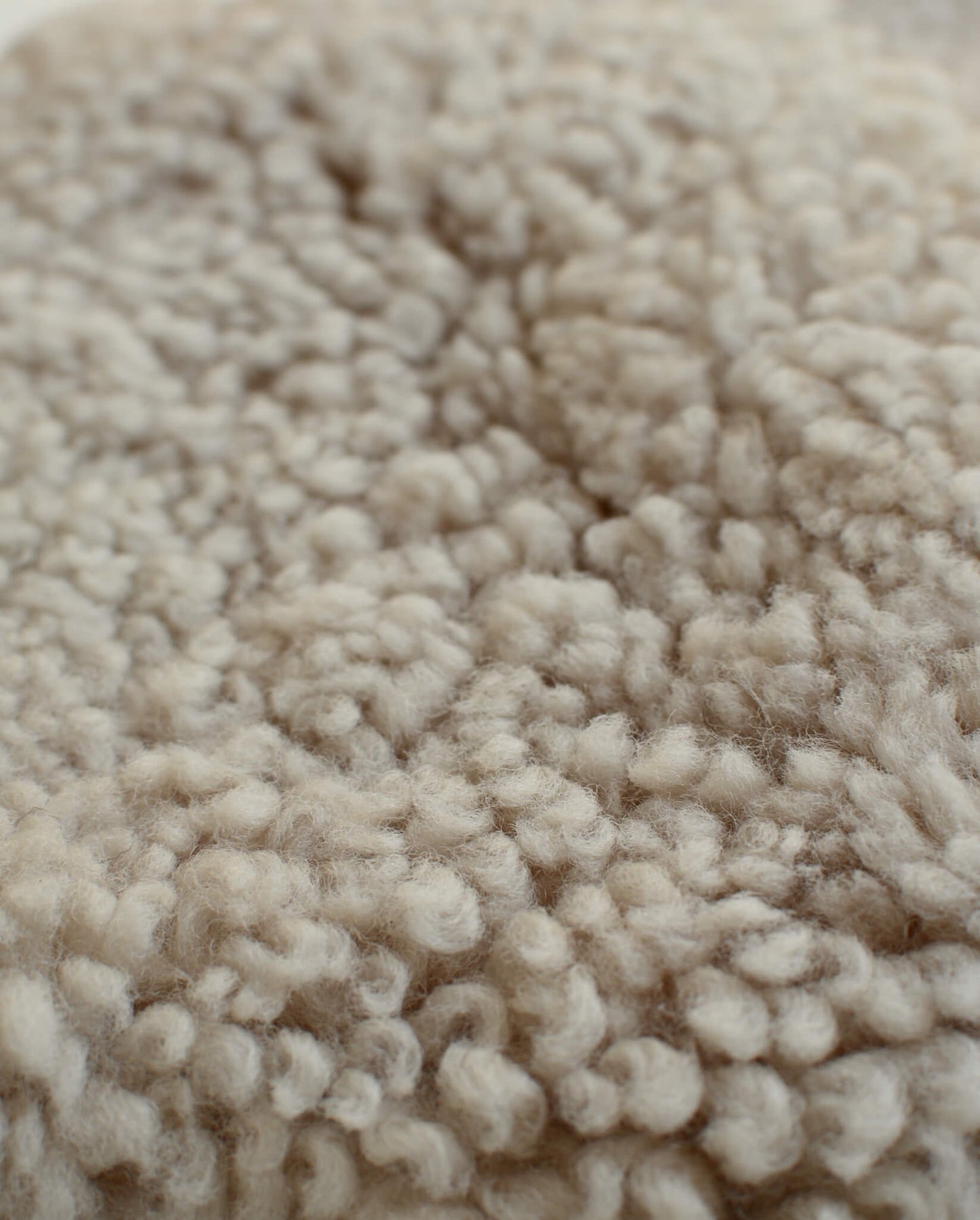 Close-up of cream natural sheepskin.