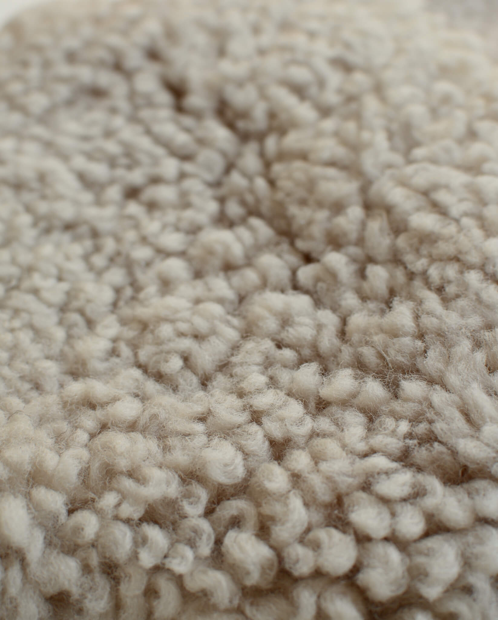 Close-up of cream natural sheepskin.