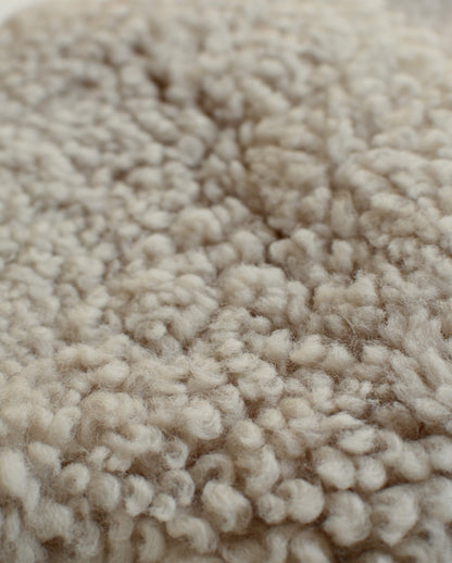 Close-up of cream natural sheepskin.