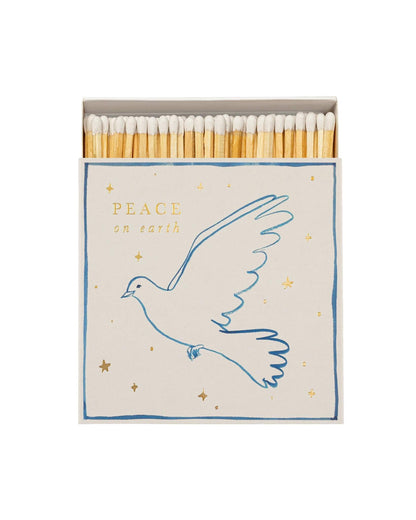 Matches with a dove design and 'Peace on Earth' text on a white background
