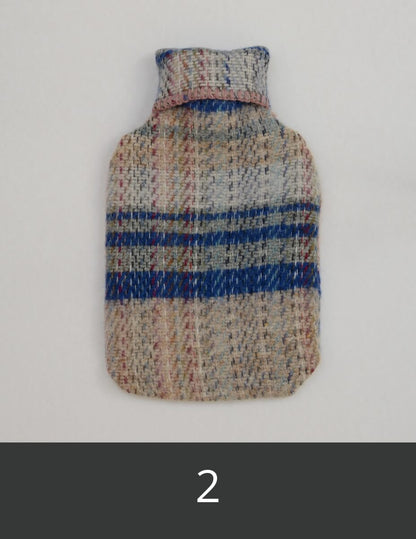 Woollen hot water bottle cover with blue and grey stripes.