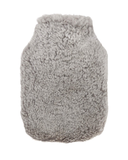 Pale grey sheepskin hot water bottle cover on a white background.