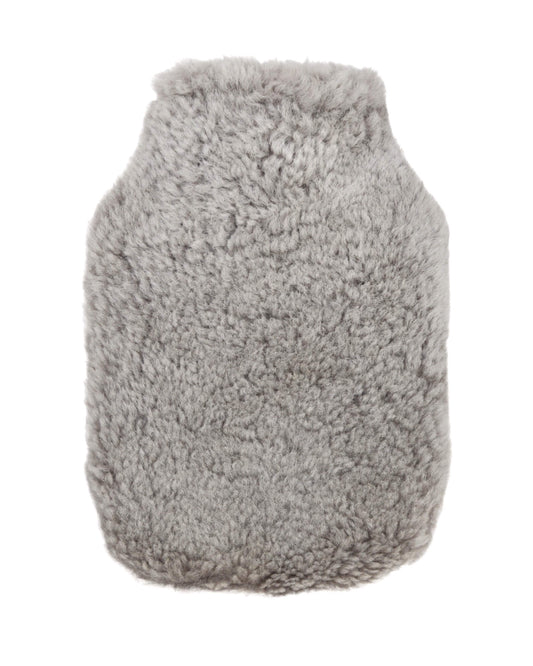 Pale grey sheepskin hot water bottle cover on a white background.