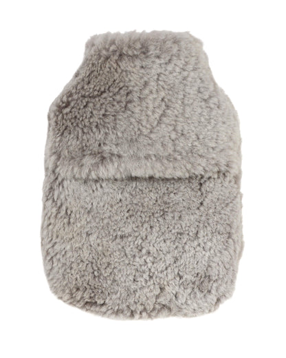 Pale grey sheepskin hot water bottle cover on a white background.