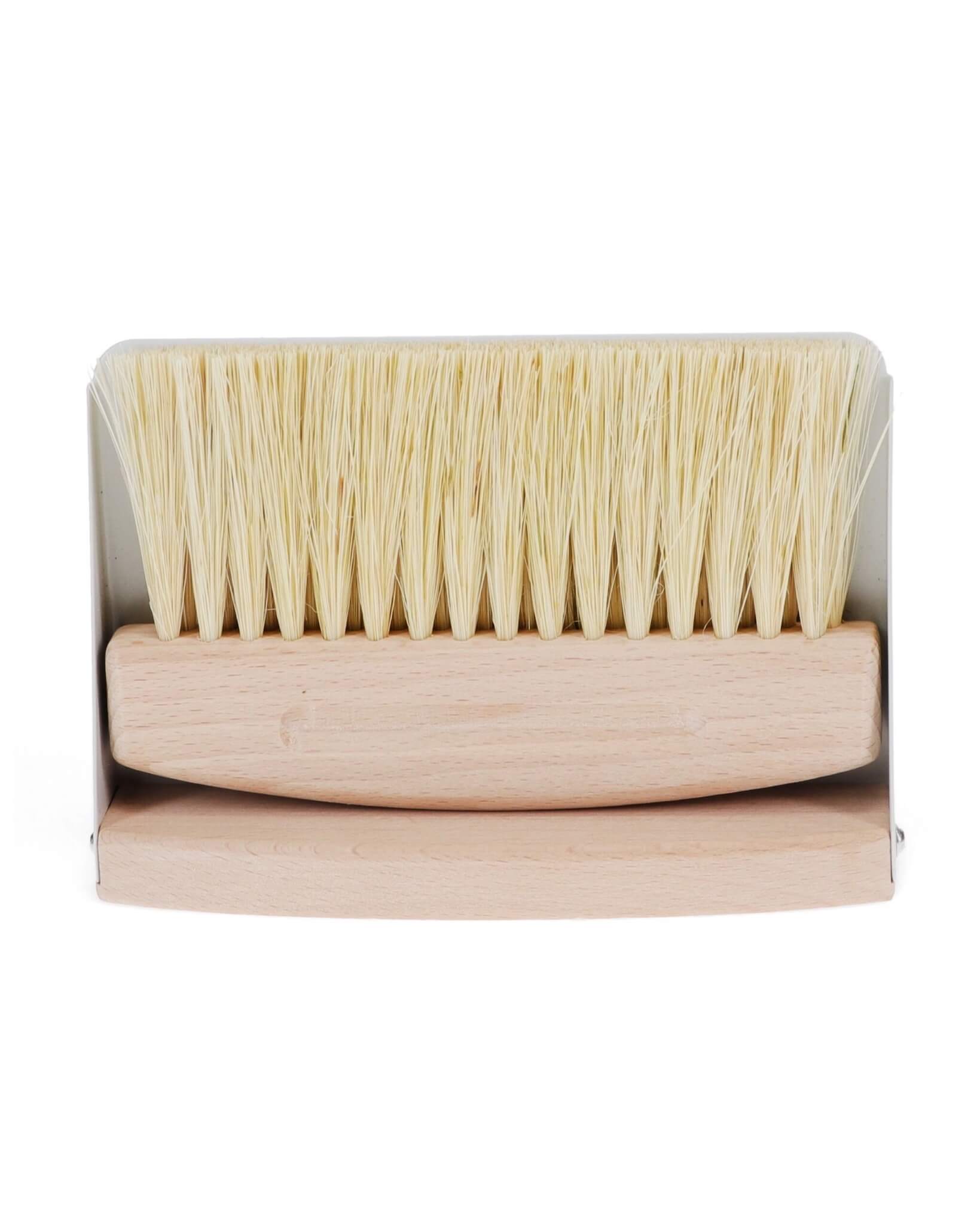 A wooden table brush and pan set, on a white background.