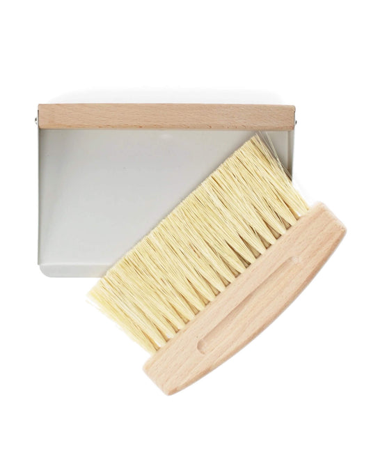 A wooden table brush and pan set, on a white background.