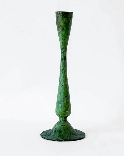 A green verdigris tall candle holder, for dinner candles.