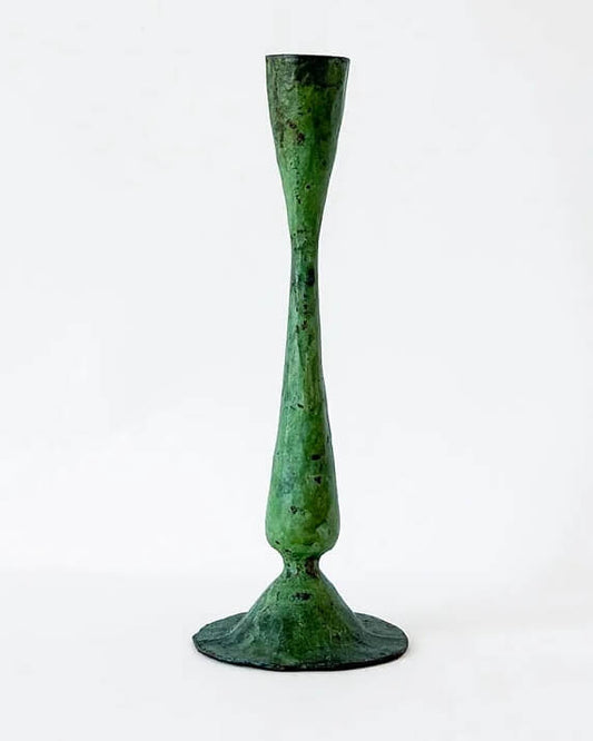A green verdigris tall candle holder, for dinner candles.