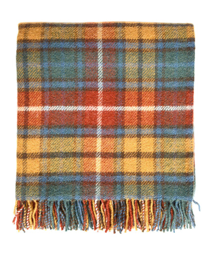 A plaid wool blanket, with tones of red, yellow and blue, on a white background. 