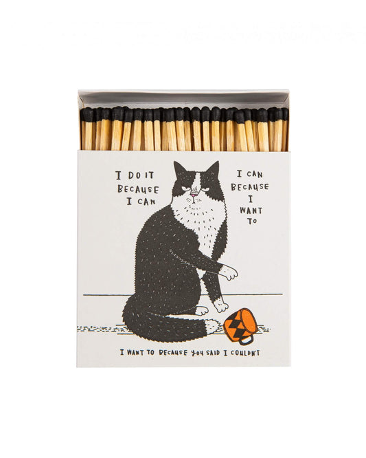 A black and white matchbox with an illustration of a cat.