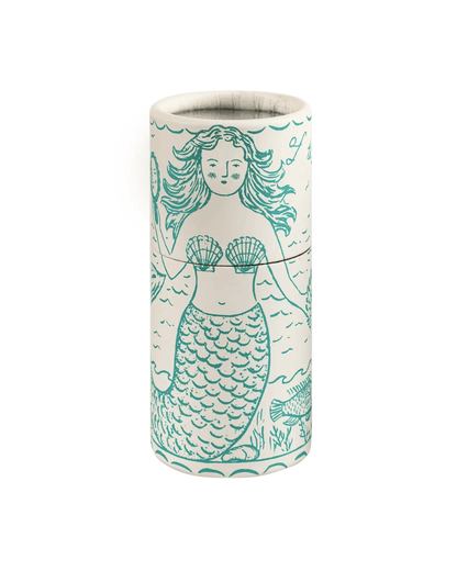 A cylindrical matchbox featuring a teal mermaid illustration, shown against a plain white background.