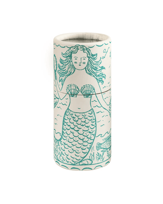 A cylindrical matchbox featuring a teal mermaid illustration, shown against a plain white background.