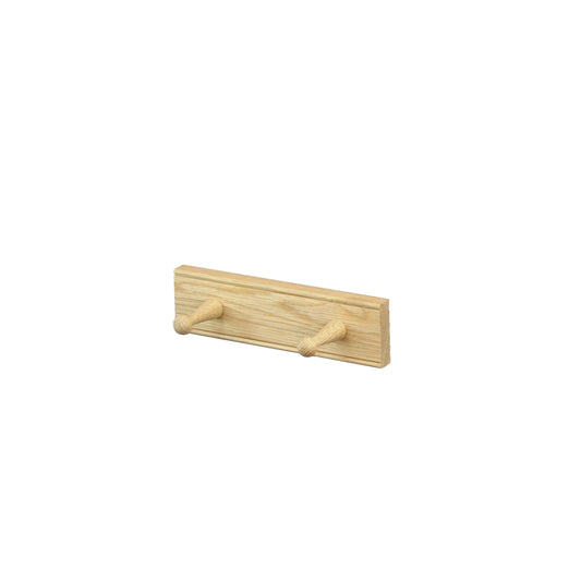 An oak peg rail with 2 pegs by Creamore Mill, on a white background