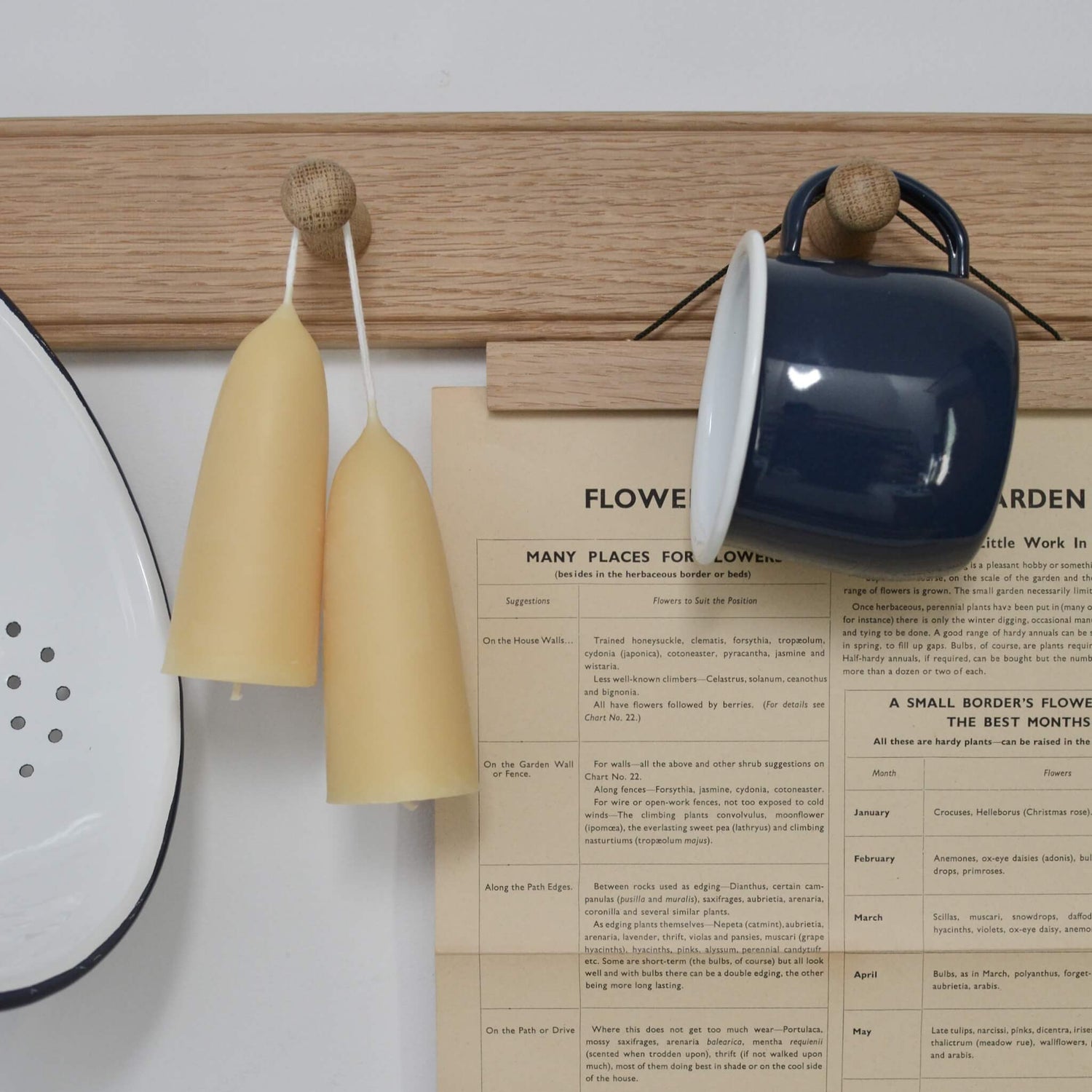 An oak peg rail, styled with candles and kitchen accessories