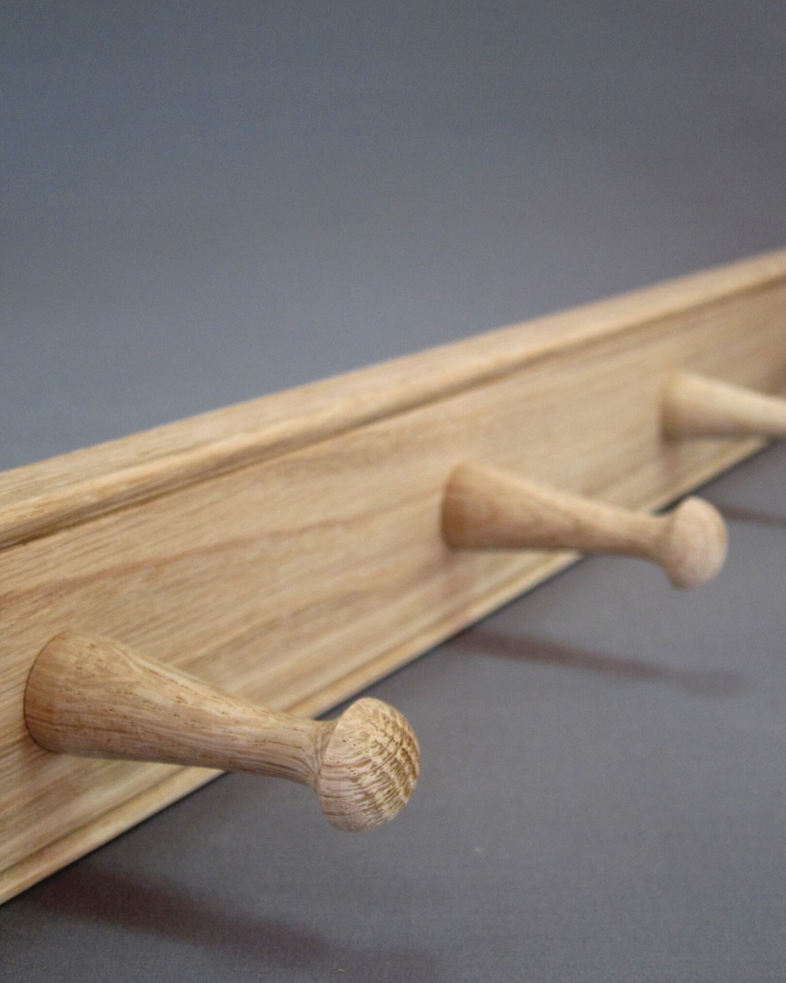 Detail of oak grain on a wooden peg rail by Creamore Mill