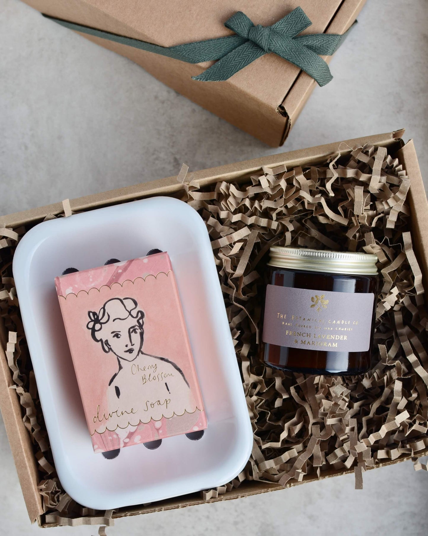 Gift set with soap, candle and soap dish in pinks and purples.