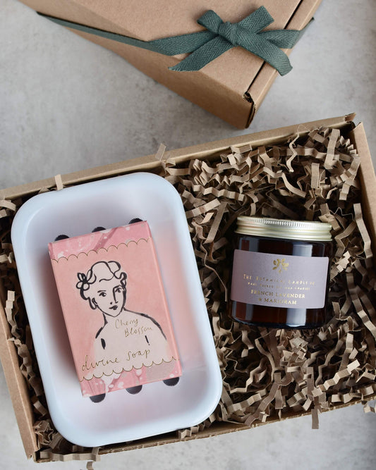 Gift set with soap, candle and soap dish in pinks and purples.