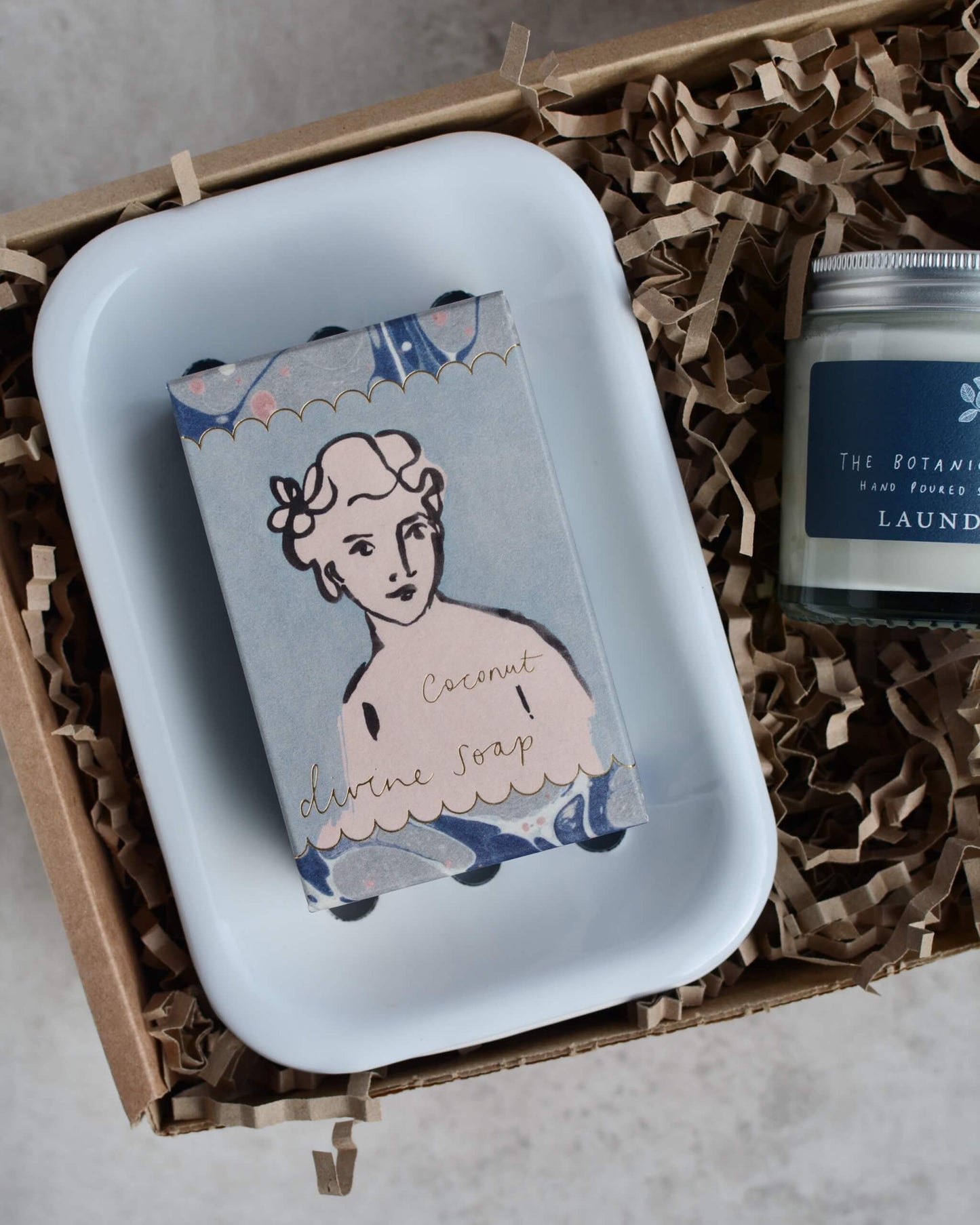 Soap dish with soap and candle in a box