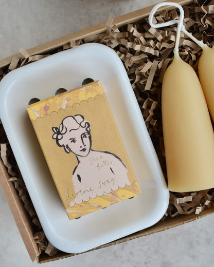 Gift set with beeswax candles, soap, and a white enamel soap dish.