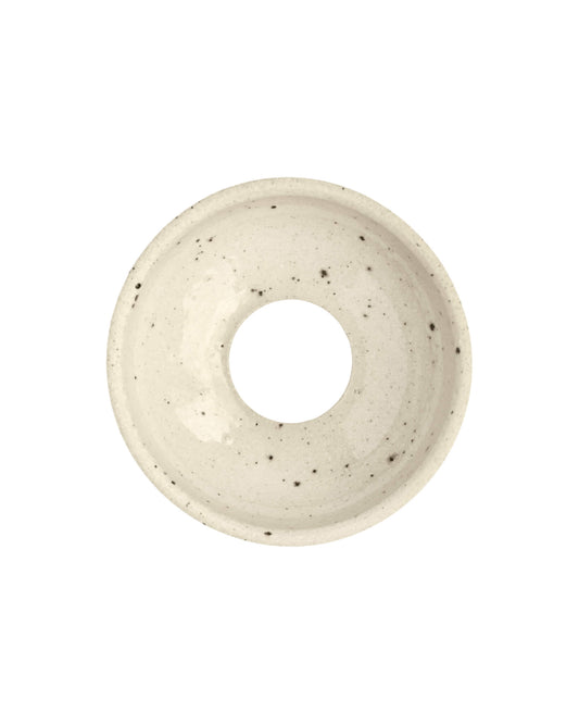 Speckled beige ceramic bulb propagator on a white background.