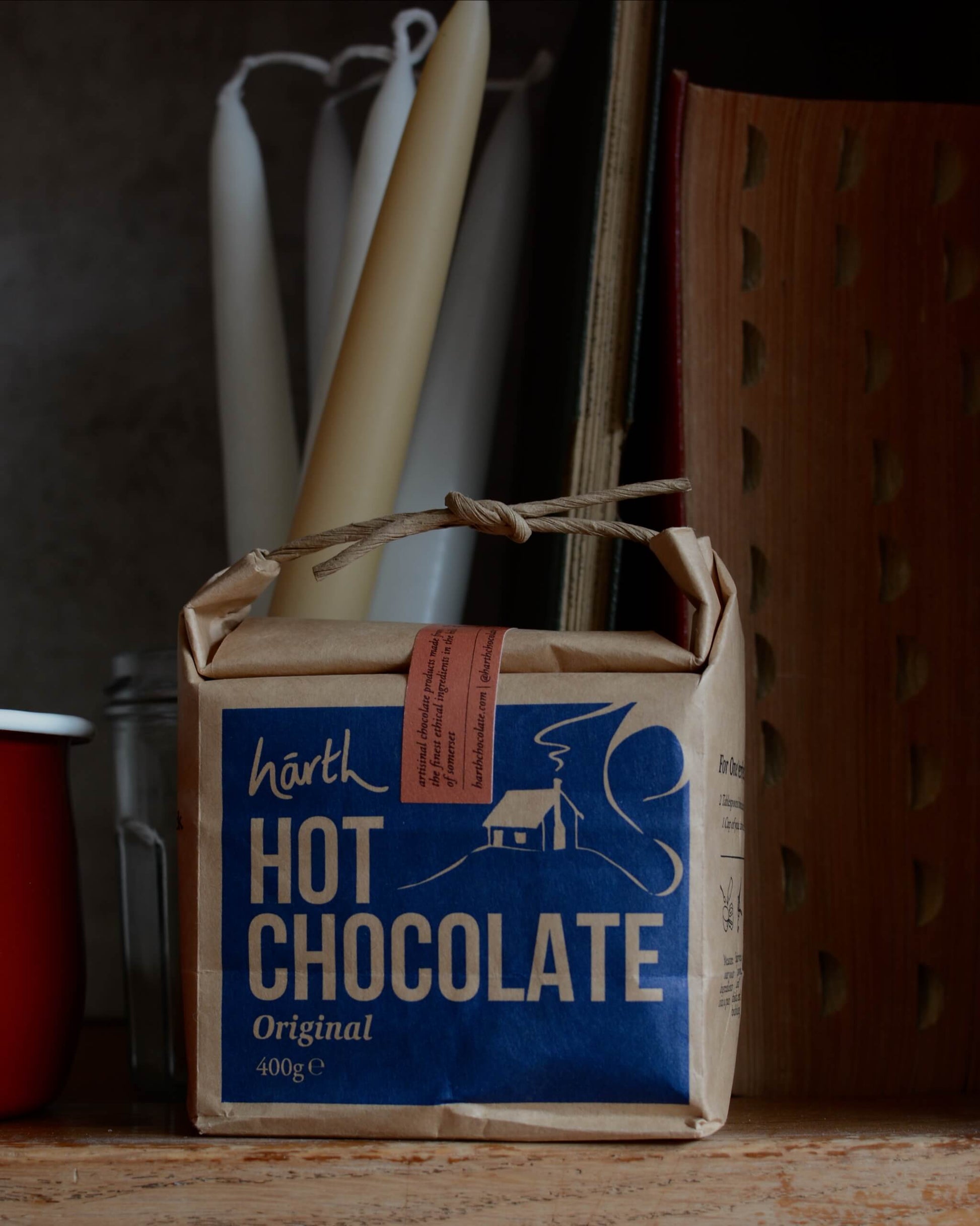 Box of Harth Hot Chocolate on a wooden surface with a rustic background