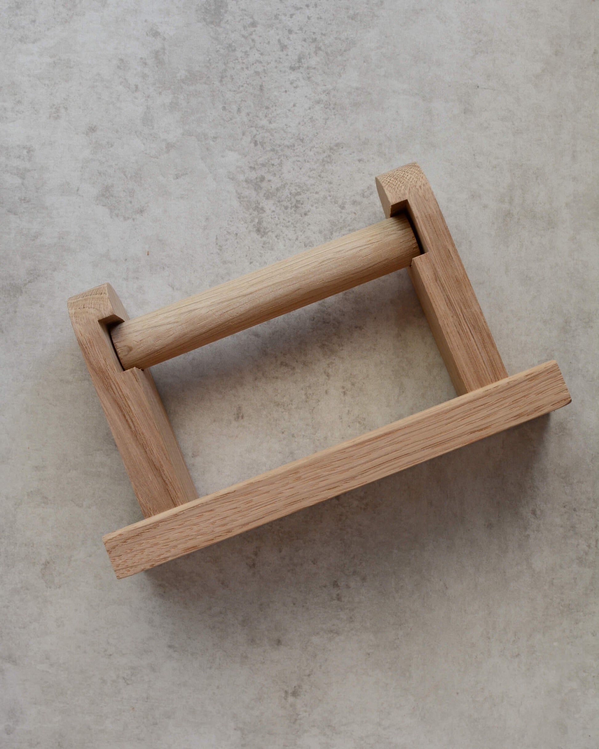 Top view of a solid oak toilet roll holder