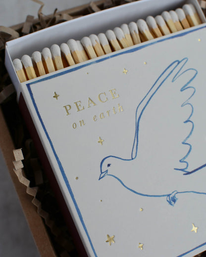 Matches with a dove design and 'Peace on Earth' text on the packaging.