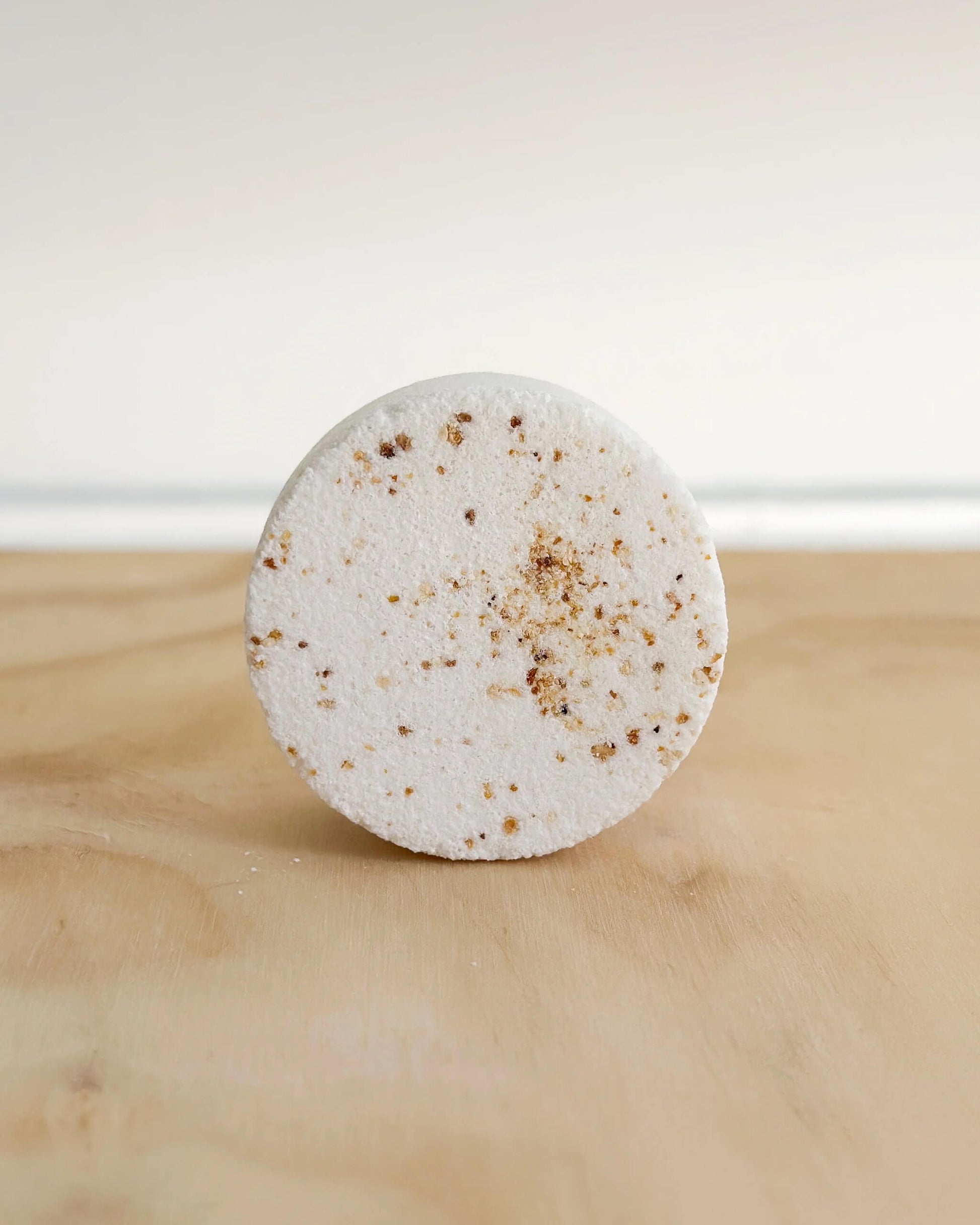 Handmade Refreshing Shower Steamer with orange and lemongrass essential oils.