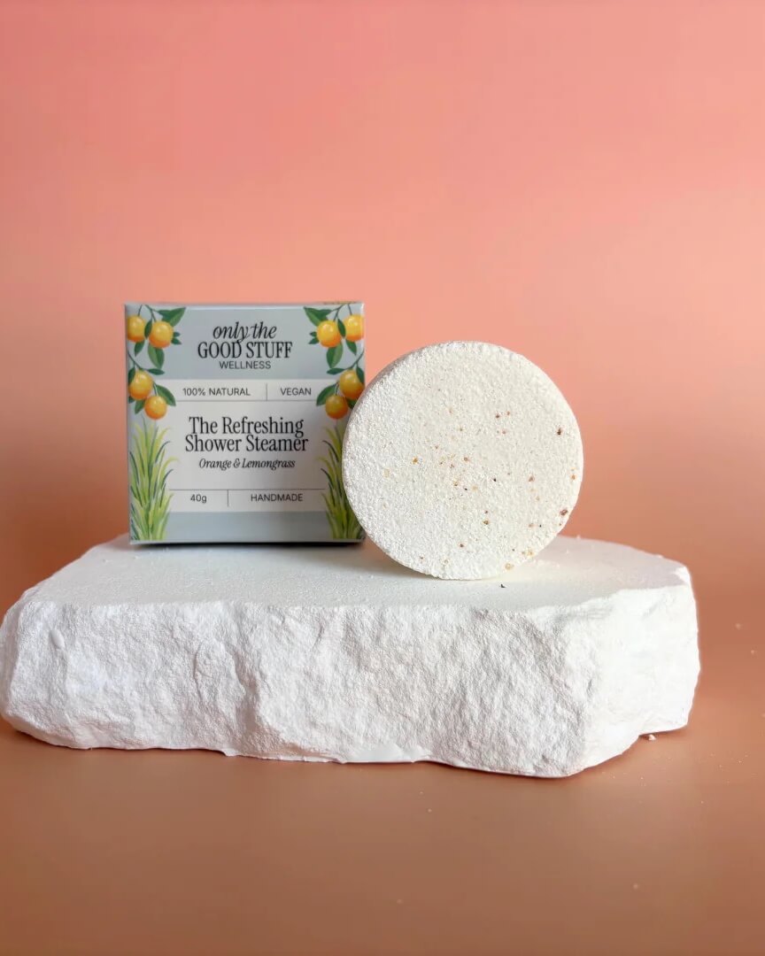 Handmade Refreshing Shower Steamer with orange and lemongrass essential oils in eco-friendly packaging.