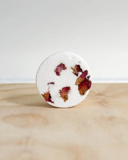 Handmade Therapeutic Shower Steamer with rose petals and geranium essential oils.