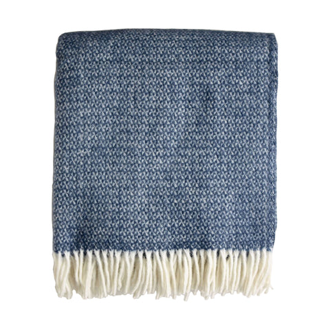 A mid blue Tweedmill windmill wool throw with an ivory fringe, shown on a white background.
